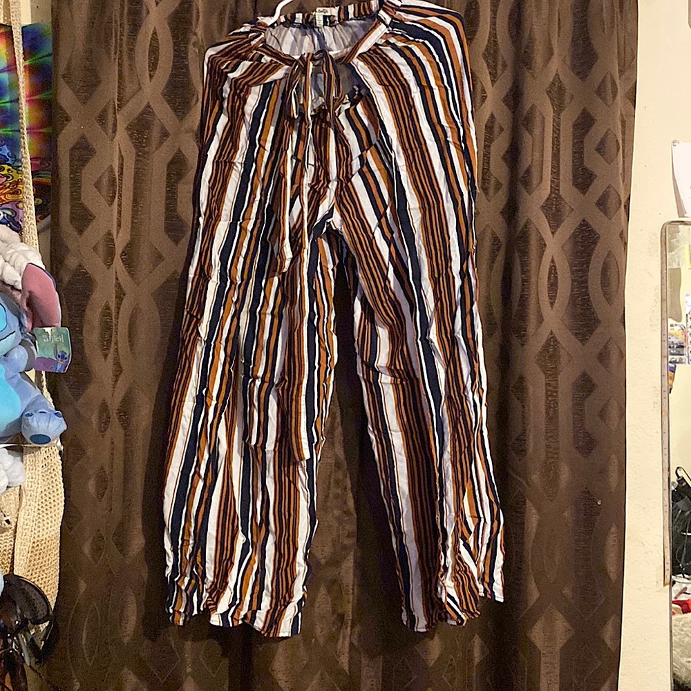 Flared dress pants , legs are slip pass the knee